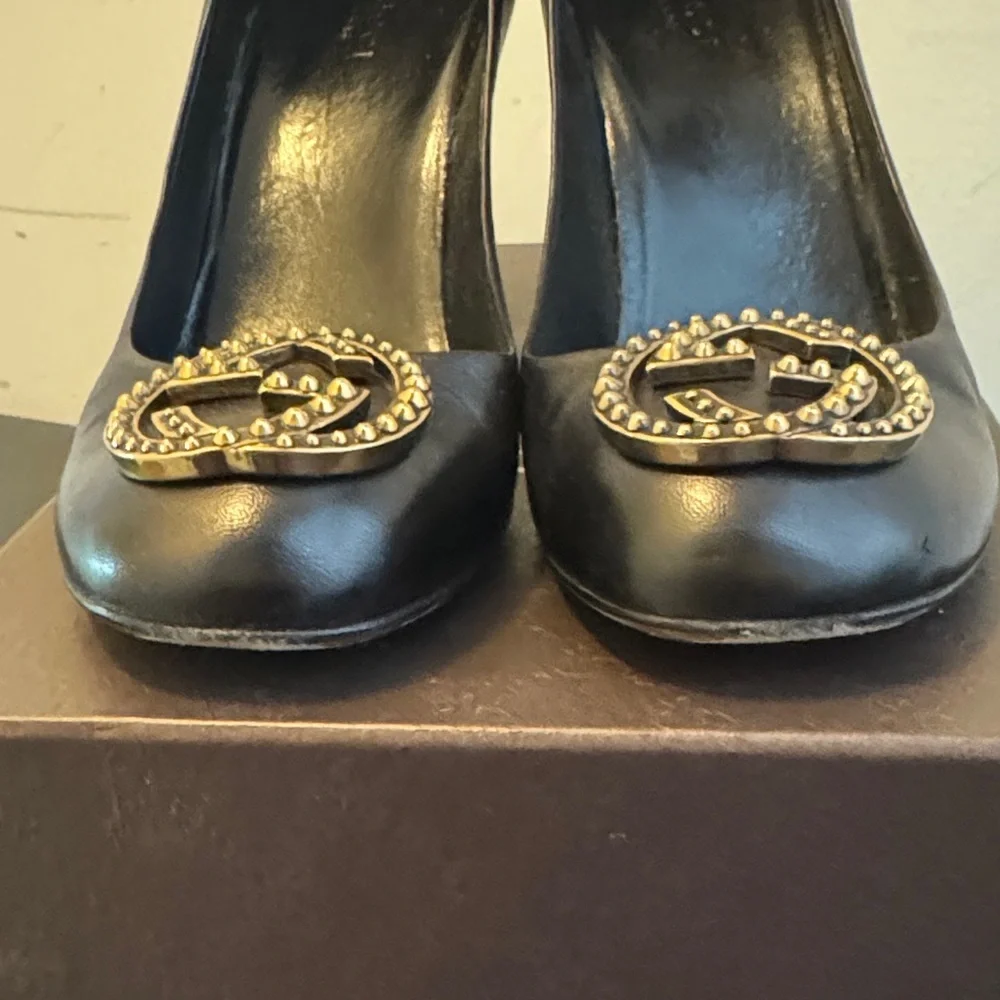 Gucci Black Heels with Iconic Gucci Gold Emblem